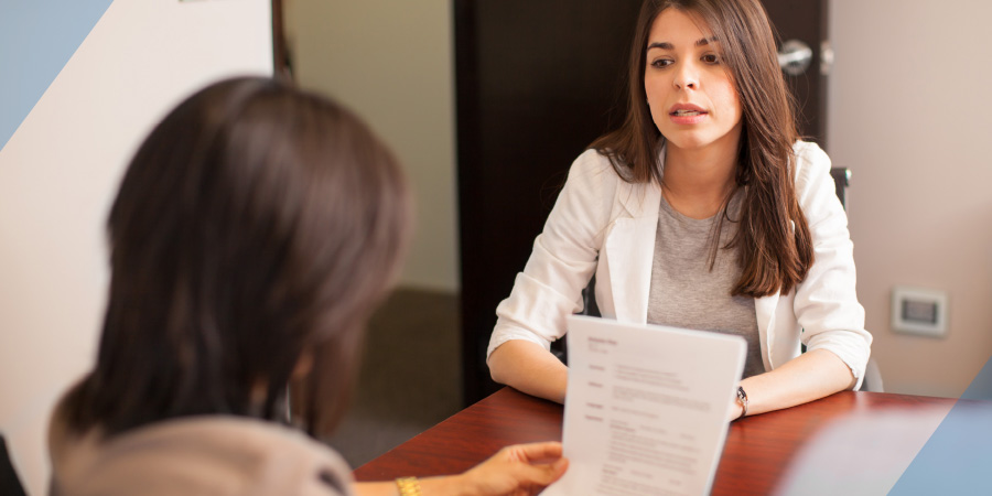 Lawyer consulting woman on legal help at a table in a law firm